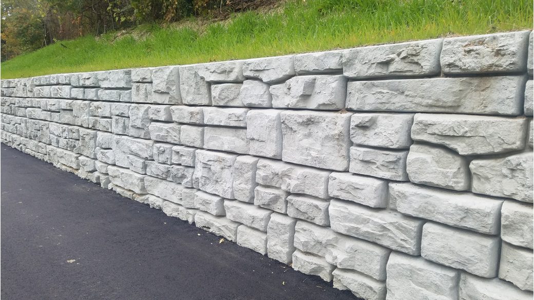 Masonry wall lining a road