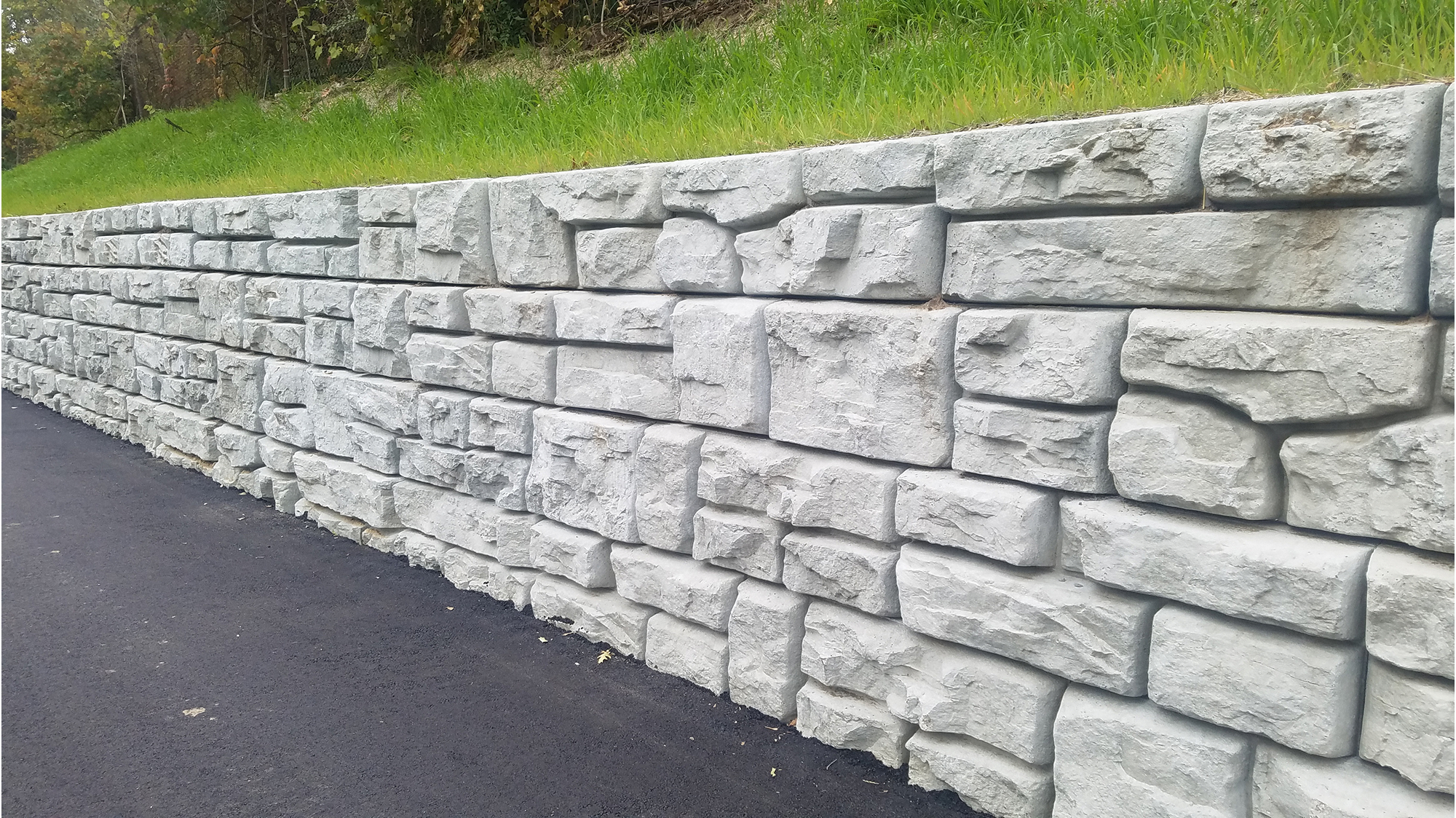 Masonry wall lining a road