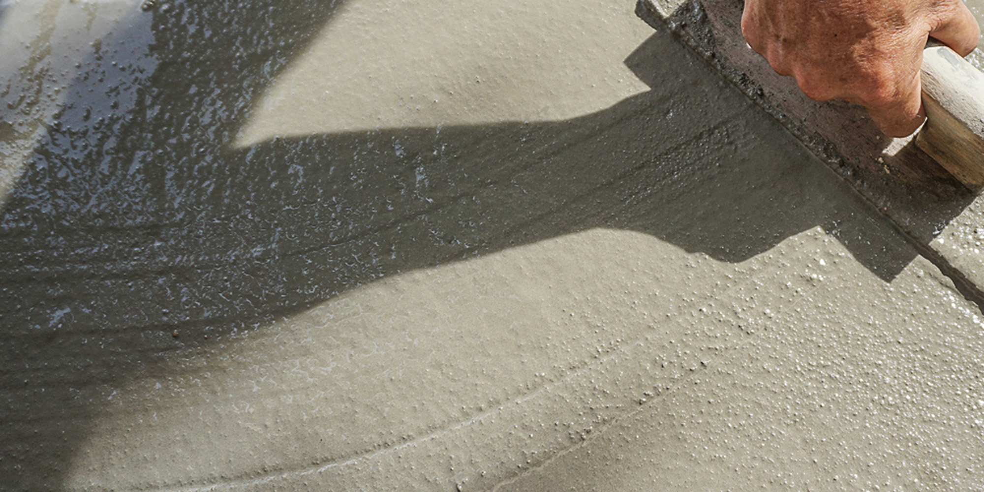 Man smoothing concrete